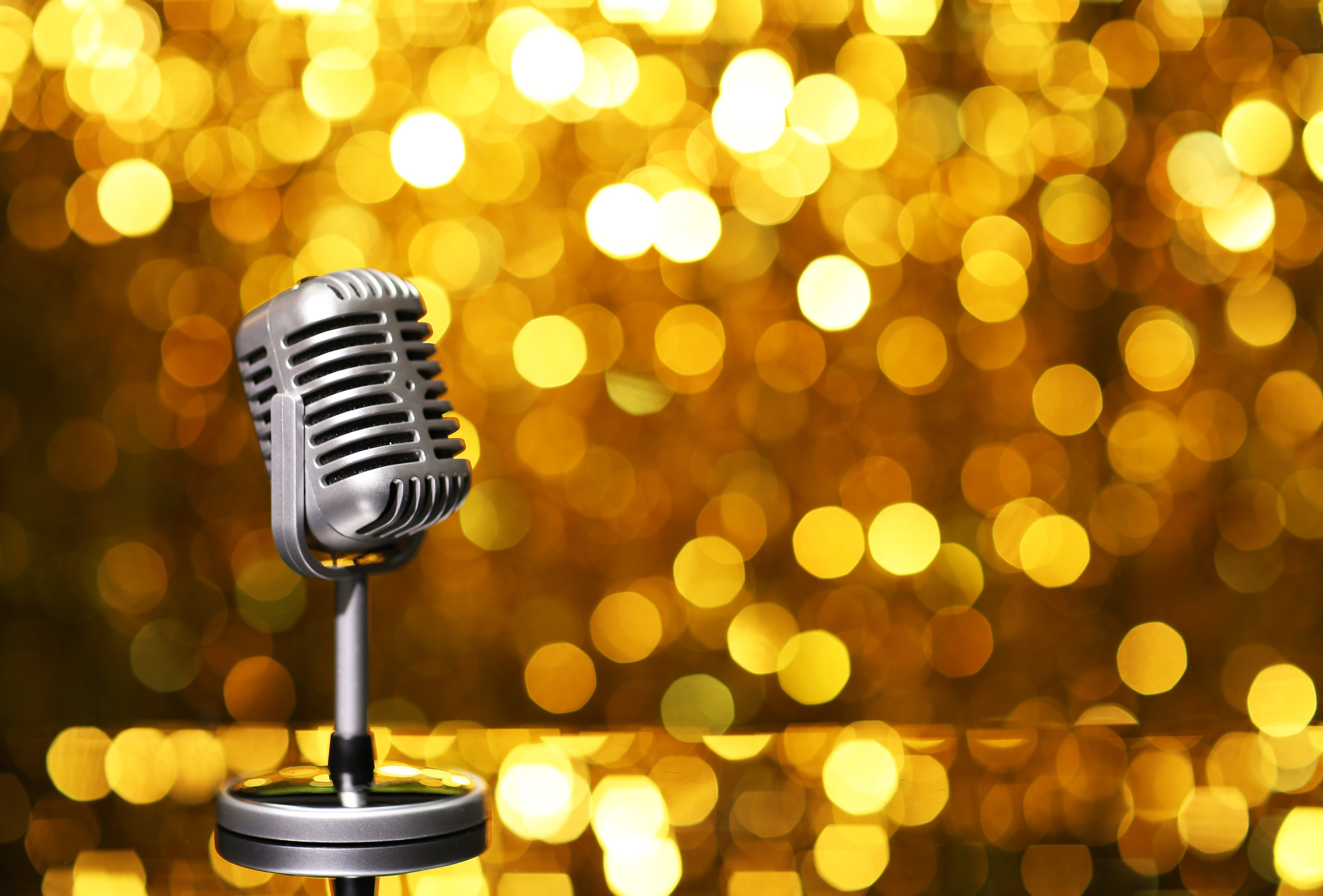 Silver Microphone on Orange Background