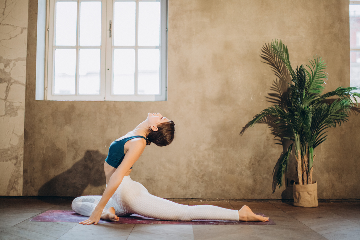 Woman Practicing Yoga Backbend